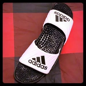 White adidas sandals with black adidas logo